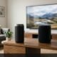 Connecting a portable Bluetooth wireless speaker to a modern flat-screen TV on a wooden living room media console