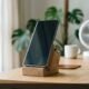 Smartphone resting upright on desk in front of fan after liquid detected in charging port